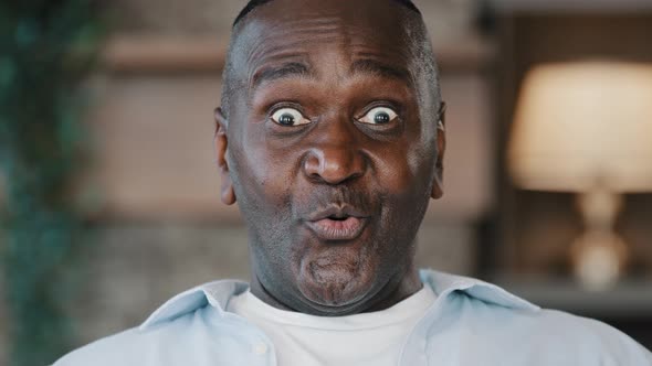 Close Up Surprised Male Portrait Amazed Face American African Adult Man 60s Senior Businessman alt