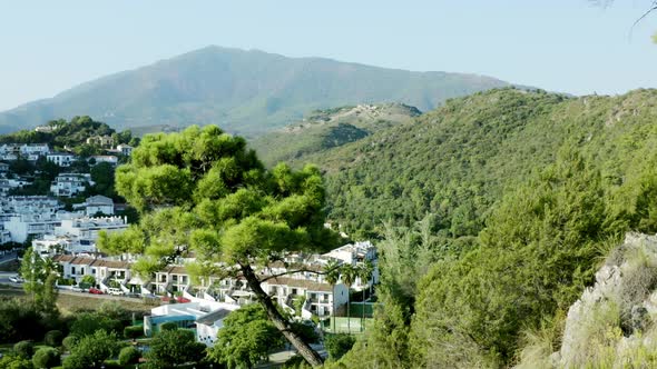 Revealing shot of mountain village  in west of costa del sol - Benahavis alt