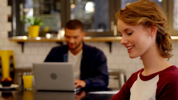 Smiling woman executive working in the office cafeteria 4k alt