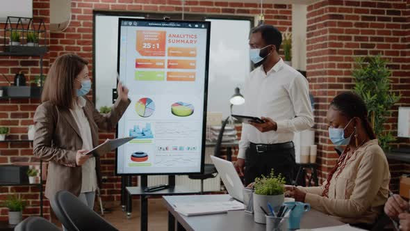 Diverse Coworkers Meeting to Plan Business Growth and Project alt