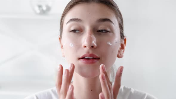 Skin Moisturizing Facial Care Woman Applying Cream alt