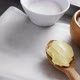 Bowl of sugar and apple, flour with butter in spoon 4k