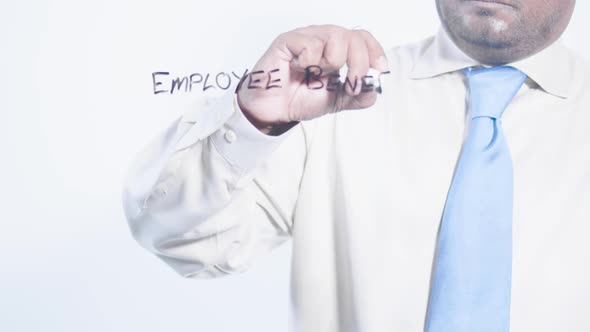 Asian Businessman Writes Employee Benefits 
