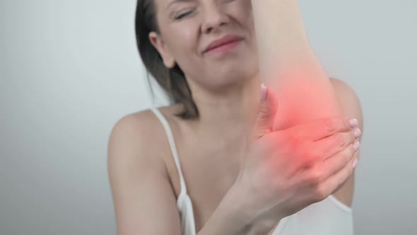 Woman with Pain in the Elbow