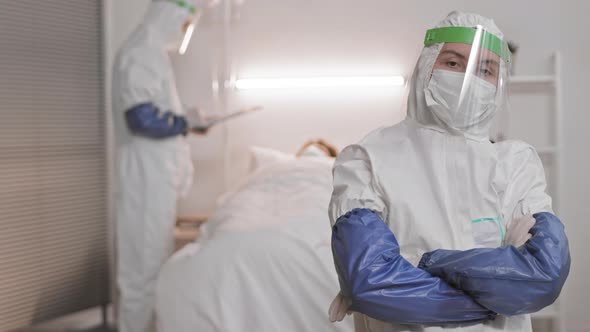 Doctor in Protective Suit Posing alt