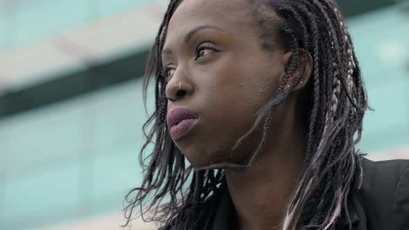 Pensive worried attractive young black african woman - Business area alt