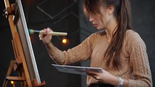 Inspiring Woman Is Drawing Her Painting Indoor alt