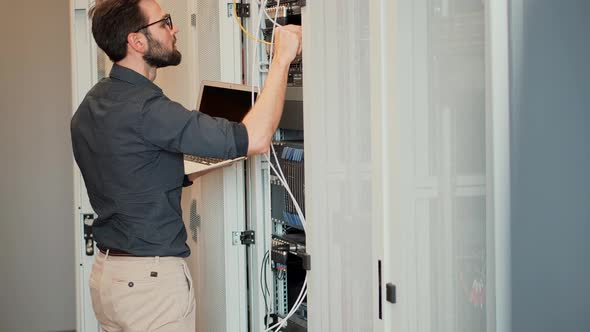 It Security Network Administrator On Server Racks. Web Security Maintenance Digital Web Hosting ISP alt