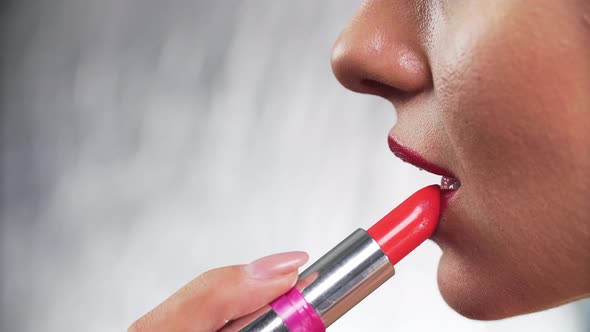 Red Lipstick. Woman Applying Lipstick On Full Sexy Lip Closeup alt