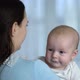 Young Mother Holding a Newborn Baby Boy in Her Arms - VideoHive Item for Sale