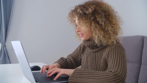 Happy young female working freelance at home on lockdown in 4k stock video alt