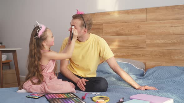 Little Cute Daughter Doing Makeup to Her Father