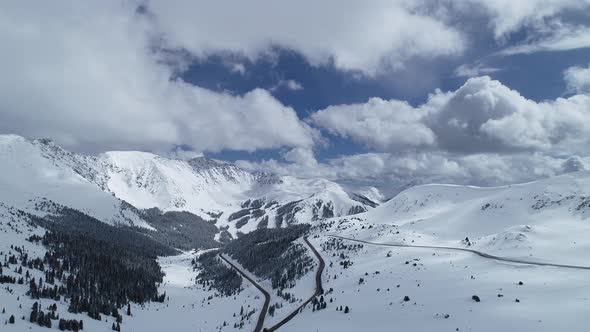 Storm brewing over the peaks on Loveland Pass, Colorado. Aerial views of mountains and highway 6. alt