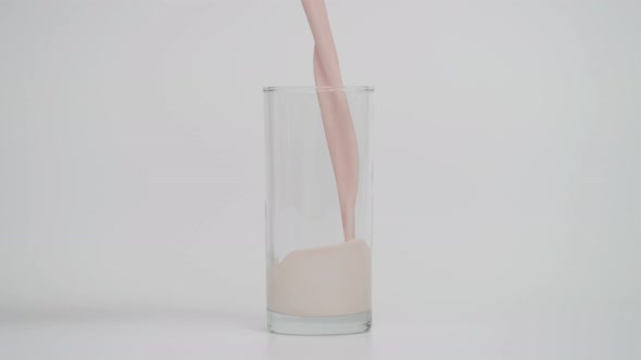 Super Slow Motion of Pouring Chocolate Milk in Glass at 1000 Fps alt