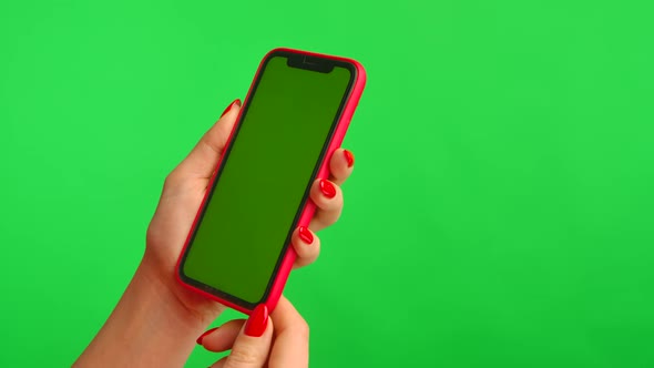 Female Hand Holds Mobile Phone with Workspace Mock Up Screen on Green Background in Vertical alt
