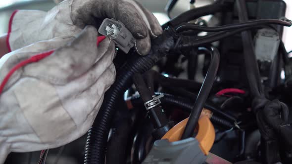 Auto mechanic working on car engine in mechanics garage, Repair and Maintenance service