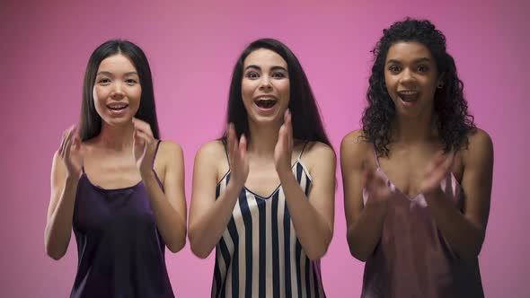 Excited Girls Looking on Camera, Surprised by Huge Discounts, Pink Background alt