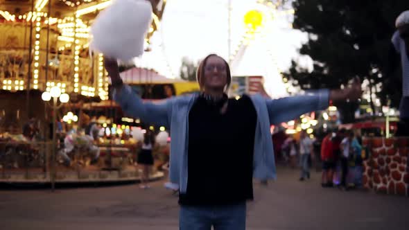 A Happy Young Girl Jumps Up Into the Air Spreading Her Hands alt