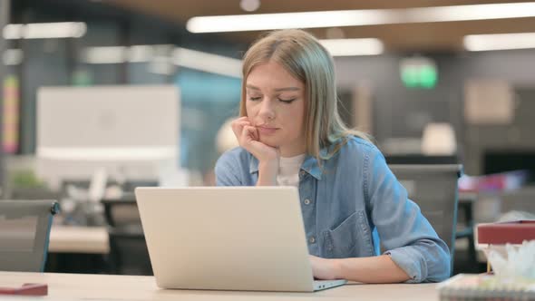 Young Woman Falling Asleep While Using Laptop in Office Nap alt