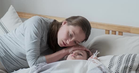 Closeup Caring Mother Touching Hot Forehead of Son Checking Body Temperature Worried About Health alt
