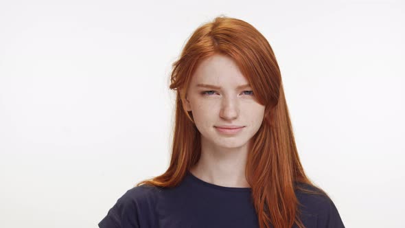 Surprised Cute Teenage Foxy Caucasian Girl Standing on White Background Raising Eyebrows alt
