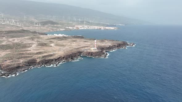 Tenerife Canary Islands Lighthouse at the Atlantic Ocean Alog the Volcanic Cliffs Rocky Coastline alt