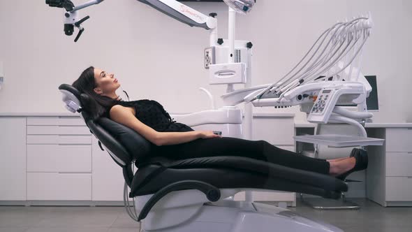 Girl Lying in a Chair in the Dental Clinic