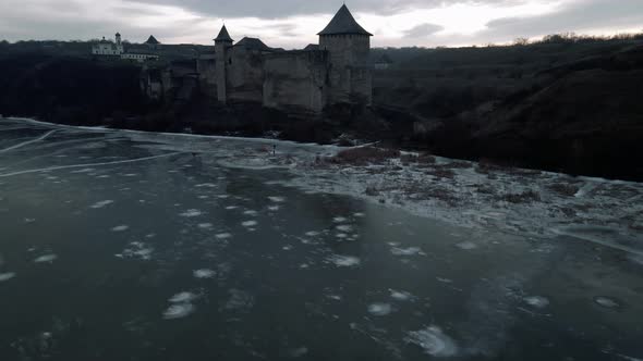 Khotyn fortress against the background of the frozen Dniester river