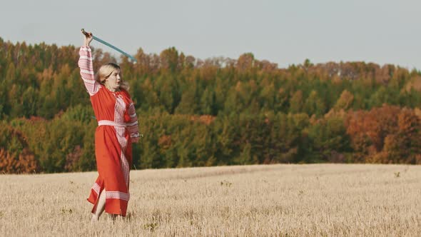 Feisty Woman in Red Dress Rotating Her Swords on the Field alt
