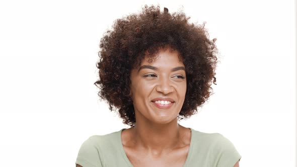 Young Beautiful African Girl Laughing Over White Background alt