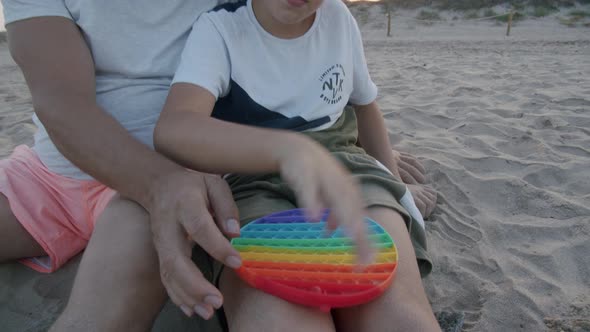 Grandfather Learning Modern Toys with Grandson alt