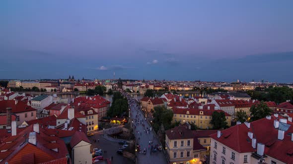 Aerial View of the Old Town Architecture and Charles Bridge Over Vltava River Day to Night Timelapse alt