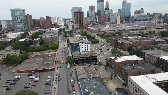 View at edge of downtown Minneapolis with historic buildings and skyscrapers. Clouds in sky.