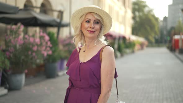Happy Woman Looking Around Turning to Camera in Slow Motion alt