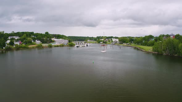 Montague, Prince Edward Island on a cloudy summer day. Drone aerial view. Camera rises from the wate alt