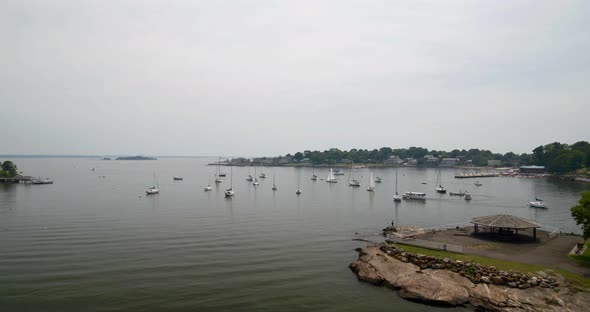Flying Over Echo Bay and Towards Docked Boats on a Cloudy Day alt