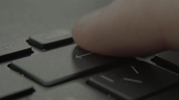 The Finger Presses the Backspace Button on the Keyboard alt