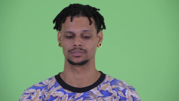 Face of Stressed Young African Man Looking Bored and Tired alt