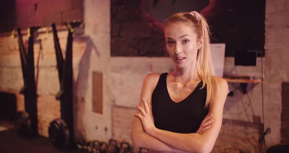 Attractive Female Athlete In Sportswear At Gym alt