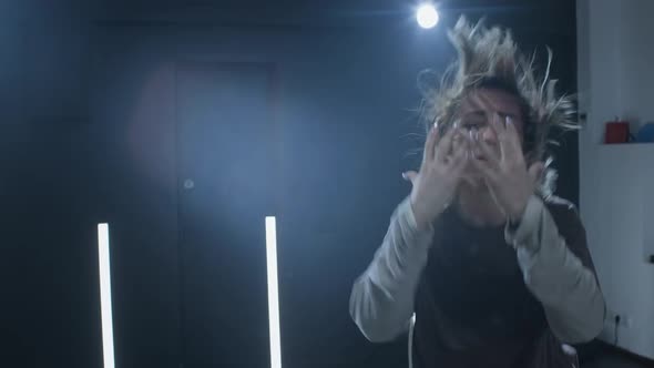 Woman Dancing Hip Hop in Dark Studio alt