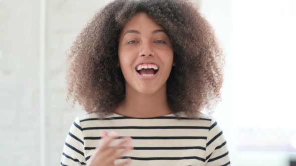 Beautiful African Woman Doing Video Chat alt