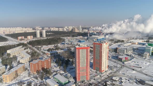 Two modern orange high-rise buildings and industrial zone with a lot of smoke 05 alt