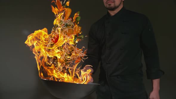 Chef with flaming stir fry in super slow motion, shot with Phantom Flex 4K