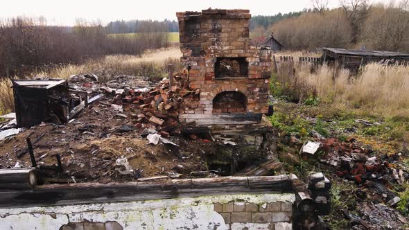 A Red Brick Stove on the Site of a Burntout Rural House Aerial View alt