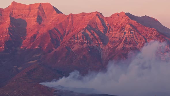 Wildfire on Timpanogos Mountain burning as the mountain glows alt