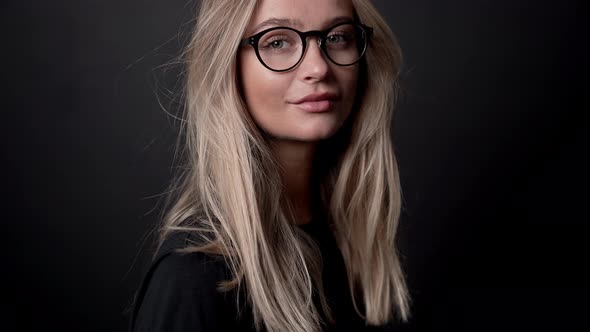 Blond Woman In Glasses Posing