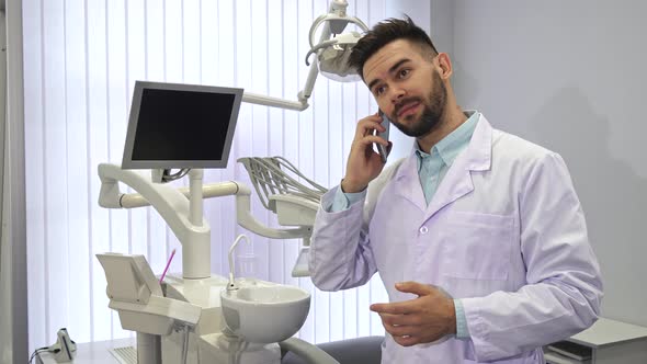 Dentist Dials Somebody on the Phone at the Office