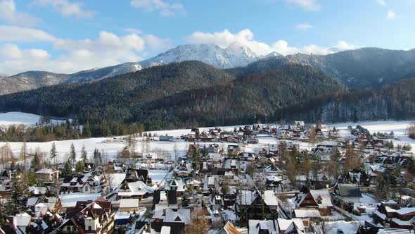 Flying over Koscielisko village towards Giewont mountain in Tatras, Poland alt