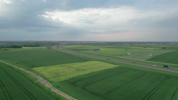 Aerial Shot of Highway or Motorway between Fields in a Countryside