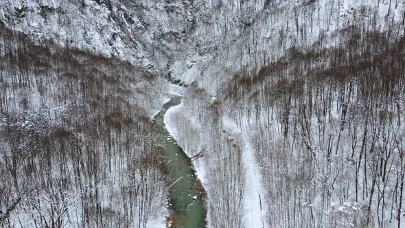 Aerial Footage of Beautiful River with Snowy Landscape